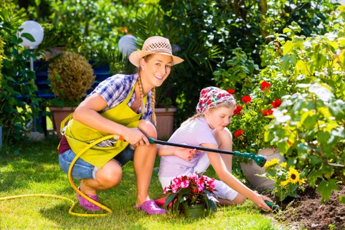 Garden tidy-up tools and green waste ready for removal
